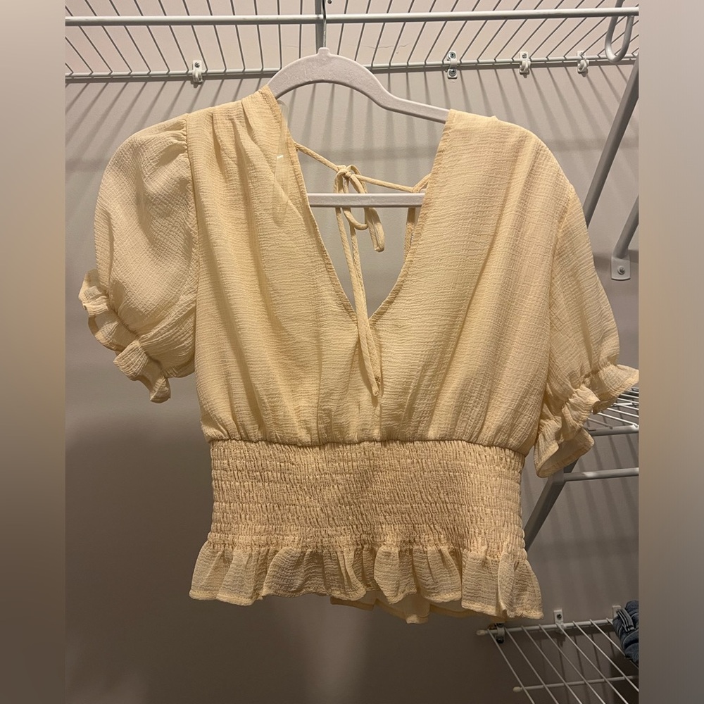 Light yellow ruffled top